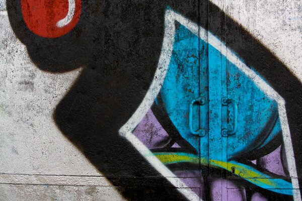 Metal door decorated with colorful graffiti