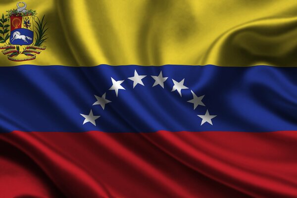 Bright colorful flag of Venezuela with coat of arms