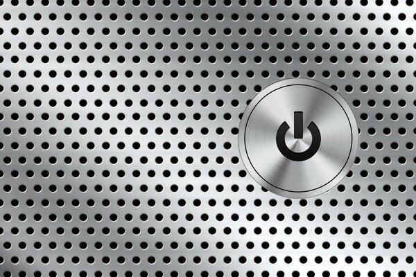 Button on a metal panel with holes