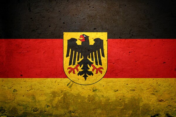 Testura. Bandiera della Germania sulla trama del cemento