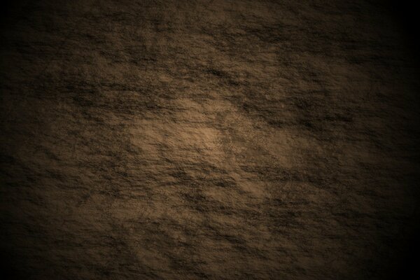Relief texture with visible irregularities on brown