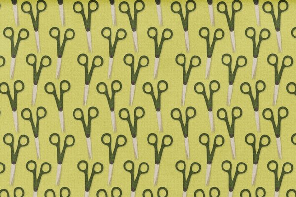 Lots of scissors on a khaki background