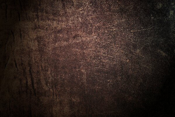 Dunkle lederne Textur mit Rissen
