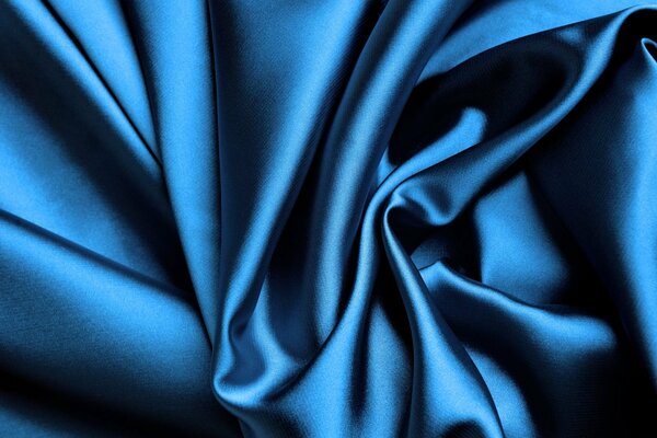Blue shimmering silk in a fold