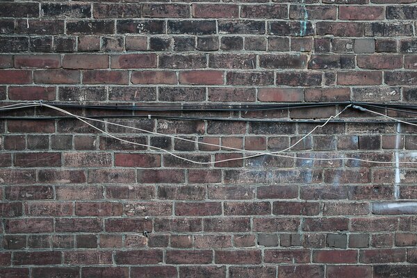 Cable on an old brick wall