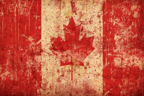 Aged flag of Canada with maple leaf