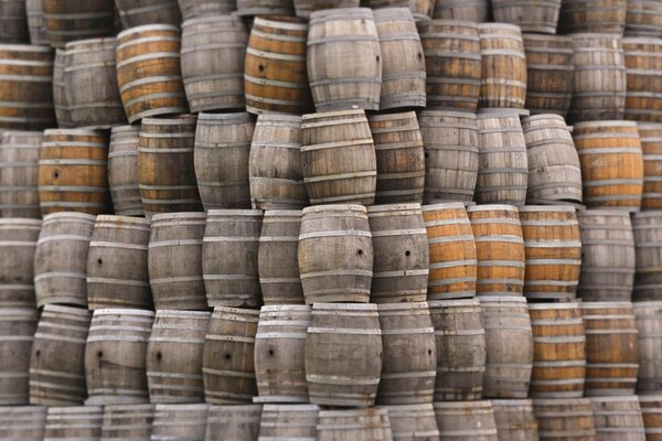 A mountain of wooden brown barrels