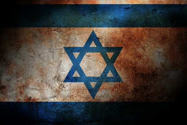 The flag of Israel on a worn background