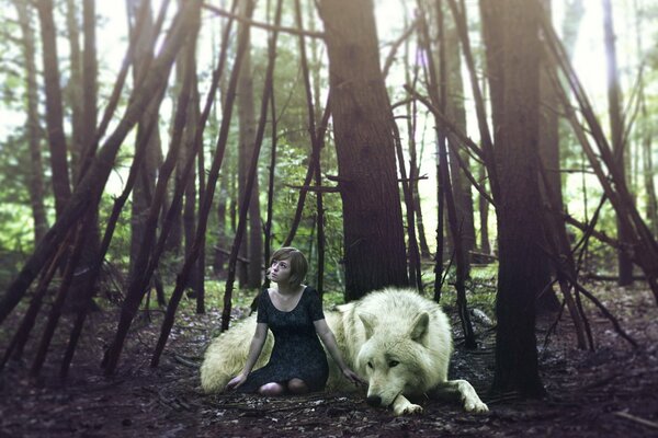 A girl with a wolf in the forest