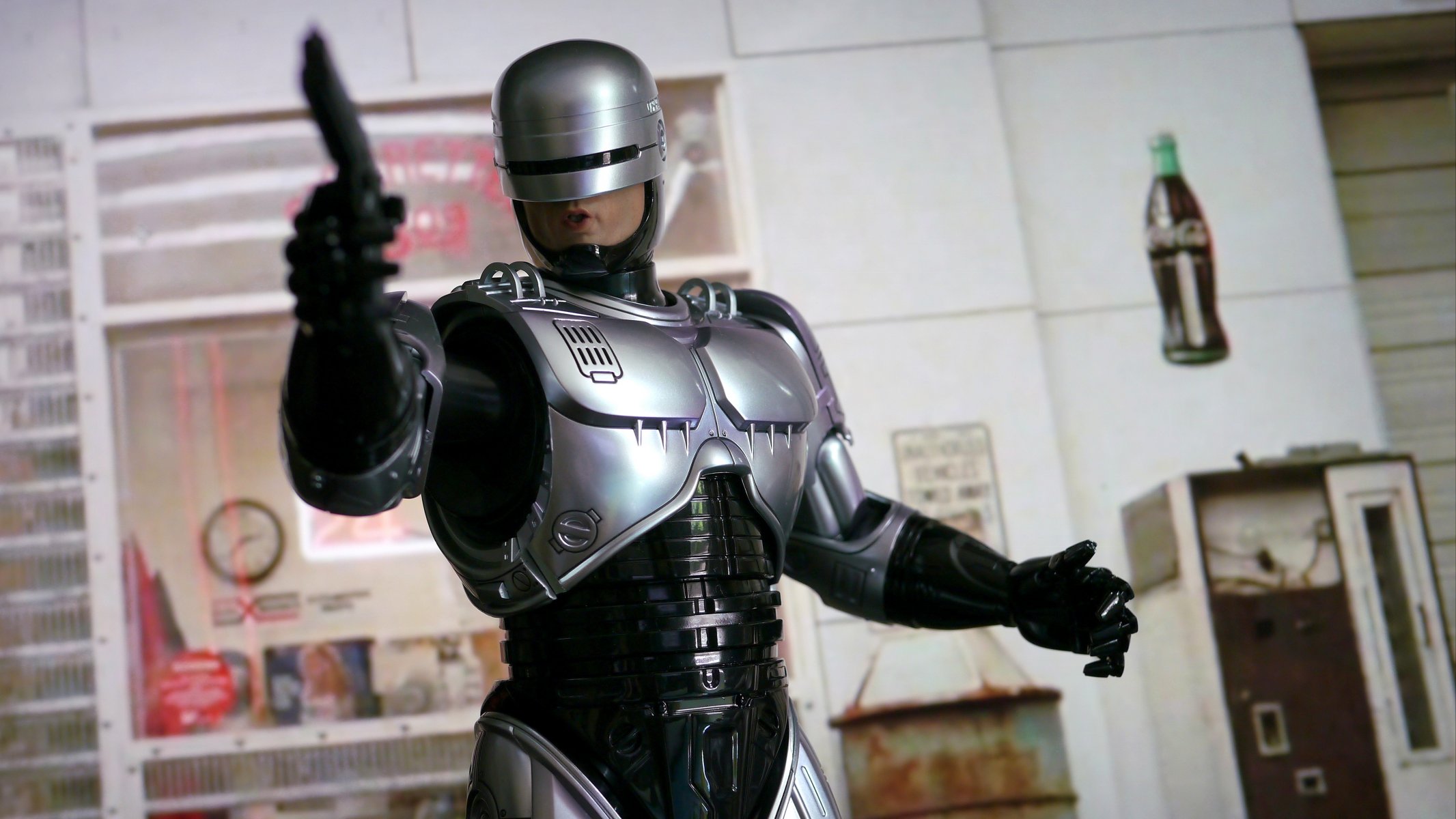 robocop robots cyborg armour gun weapon background