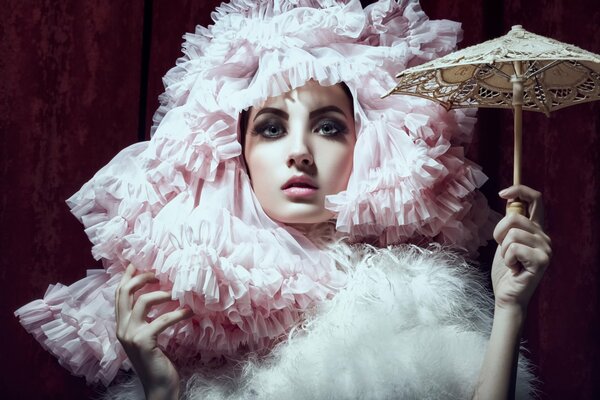 A girl in a pink balloon hat