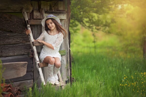 A girl with a hat in a fairyland