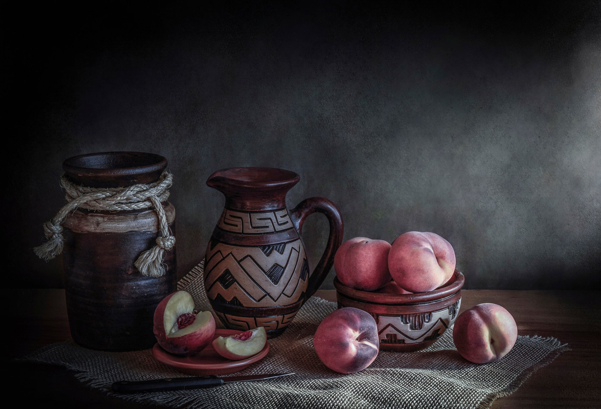 fresh peaches still life pitcher peaches knife