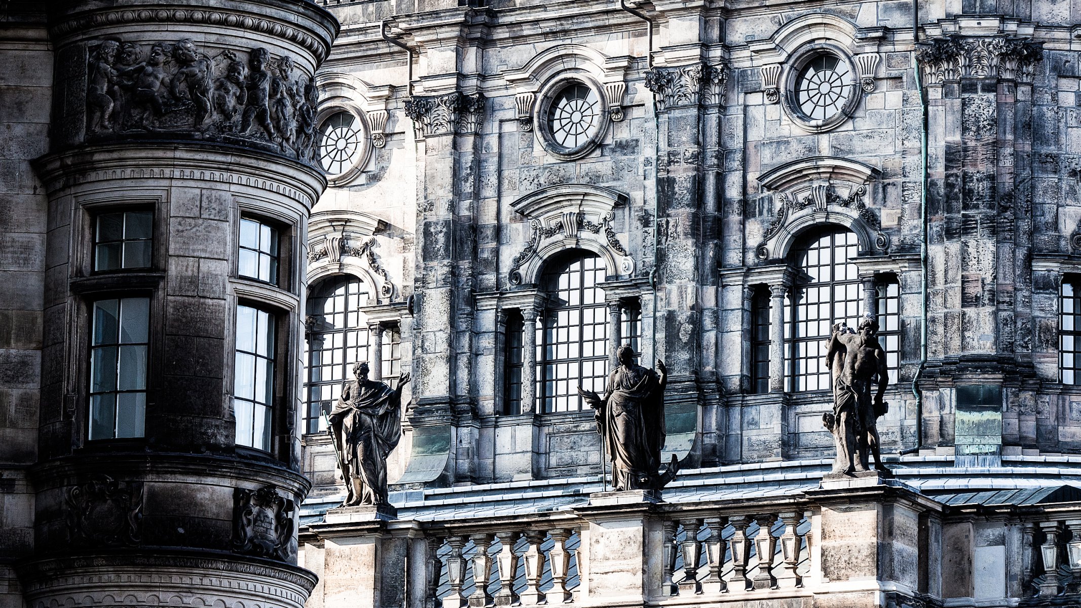 windows statues stone wall balcony