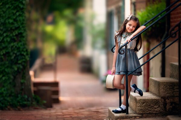 Children s photography of a girl at the steps on a sweet day