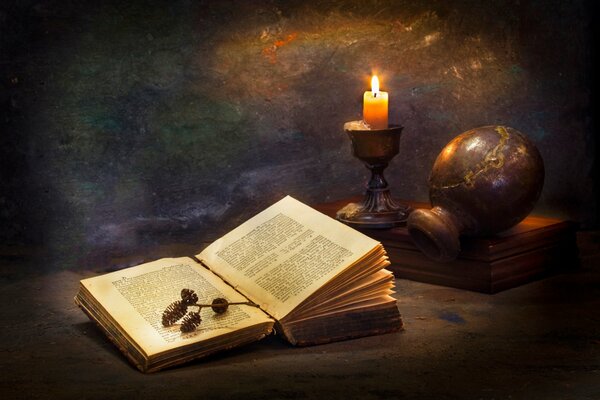 A book with a jug on a candle photo