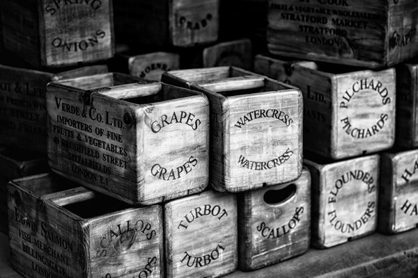 Black and white photo of tar. Boxes for fish