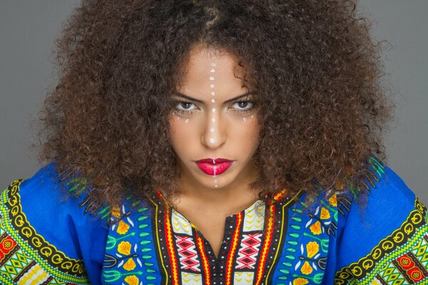 A girl with curls in an ethnic outfit