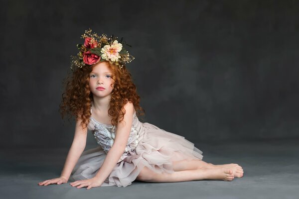 Young curly-haired model with a wreath