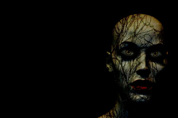 Scary female face in the dark