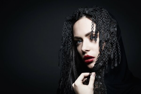 Girl with dreadlocks on a dark background