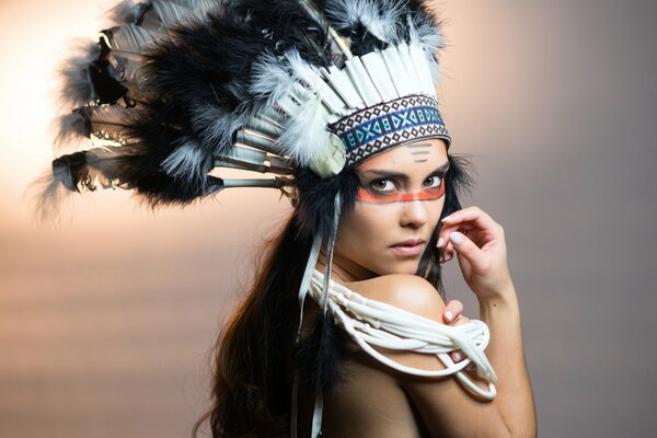 Beautiful Indian girl on beige background