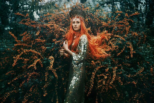 Red-haired beast in flowering shrubs