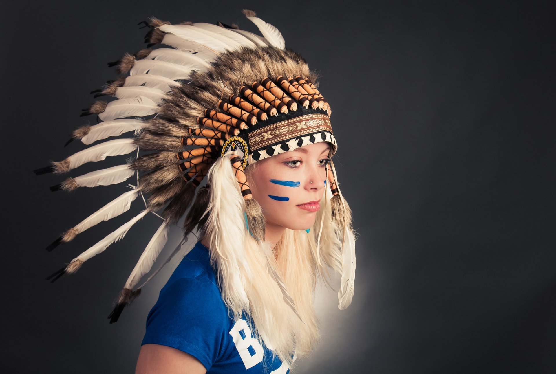 girl face headwear feathers paint