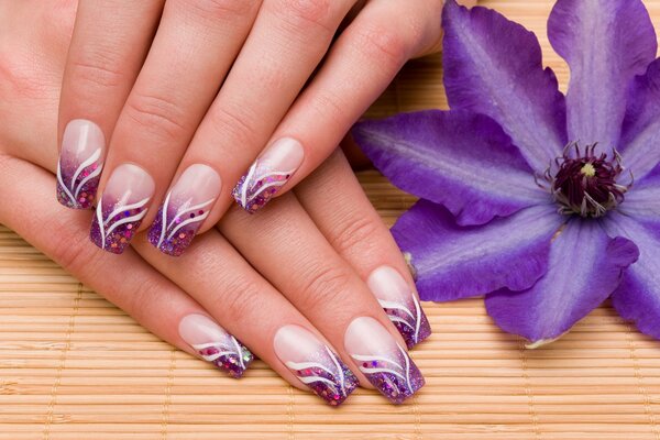 Delicate lilac manicure with white stripes