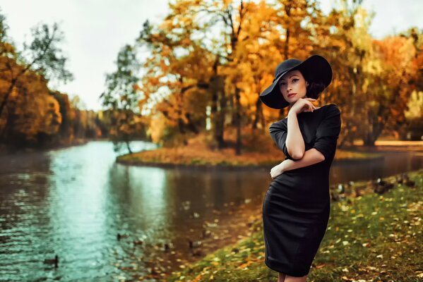 A girl in autumn in a beautiful hat