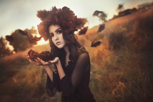 Fille avec un balai de feuilles d automne