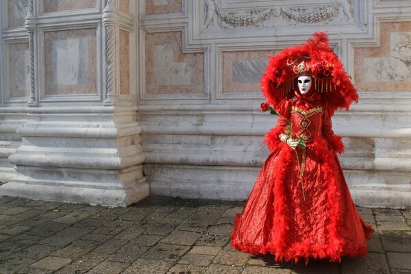 A girl in a red carnival dress