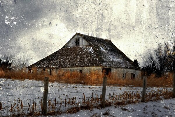 Casa en un campo cubierto de nieve