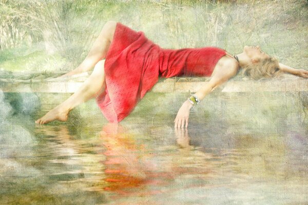 The girl in red by the pond