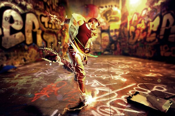 Dancing guy on the background of graffiti