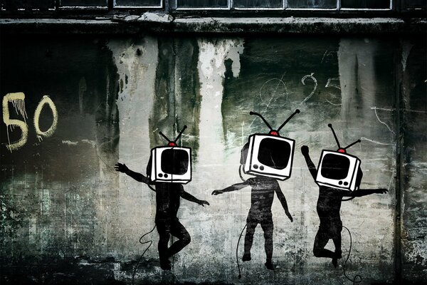 Graffiti TV sur un mur gris