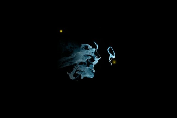 Blue smoke in a dark room