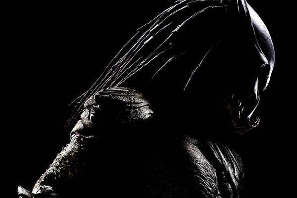 The silhouette of the predator is depicted in black