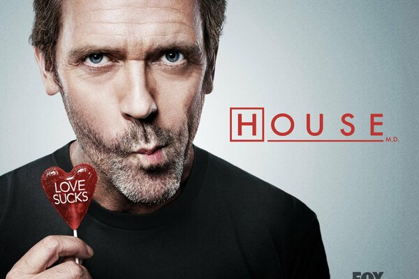 Dr. House with a red lollipop