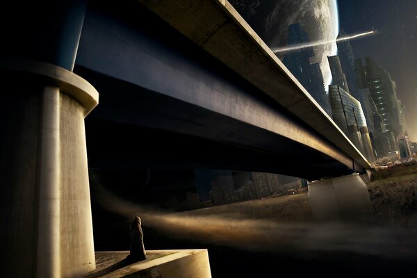 Figure solitaire de l homme sous le pont sur le fond d une immense planète en surplomb