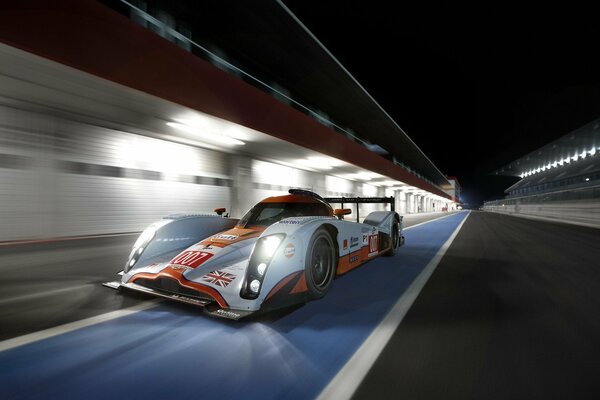 A racing car is flying on the track