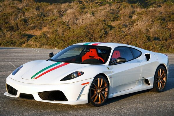 White ferrari f430 in the parking lot