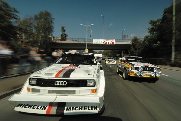 White and yellow Audi participate in the races