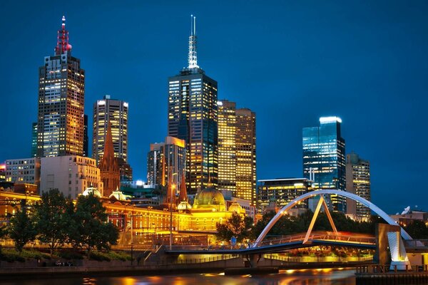 Melbourne Australia at night in the light of lanterns and burning windows