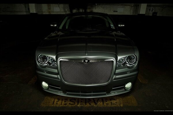 Beautiful photo of a car in the garage visible headlights