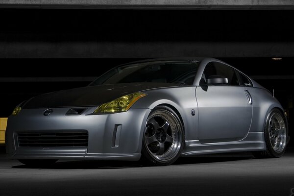 Gray nissan 350z is in the garage