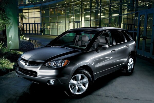 Gray SUV under night lighting