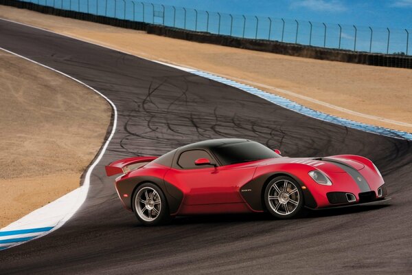 Sports car on the red-black highway