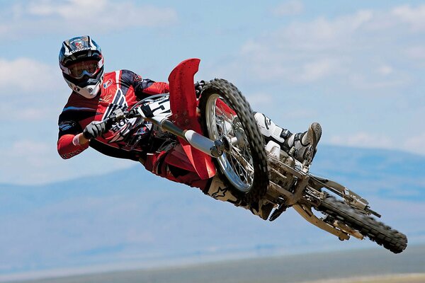 A motorcyclist performs a jump on a motorcycle