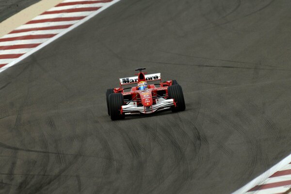 Red car in a skid on the race track